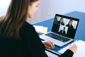 The virtual team meets in an online video conference